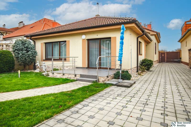 A family house in Senec on Školská Street with a terrace and garden.