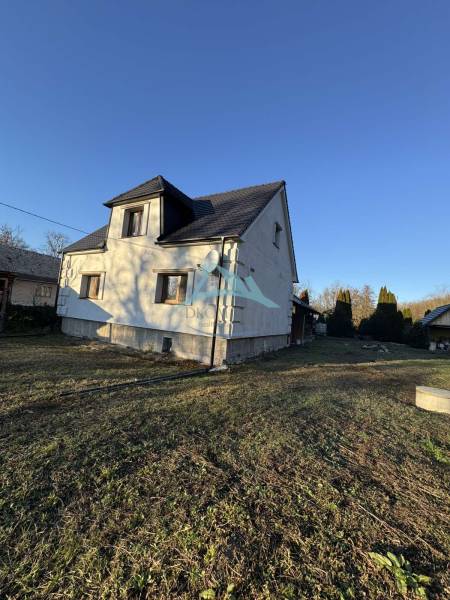 A family house in Demandice with two floors and a grass-covered plot.