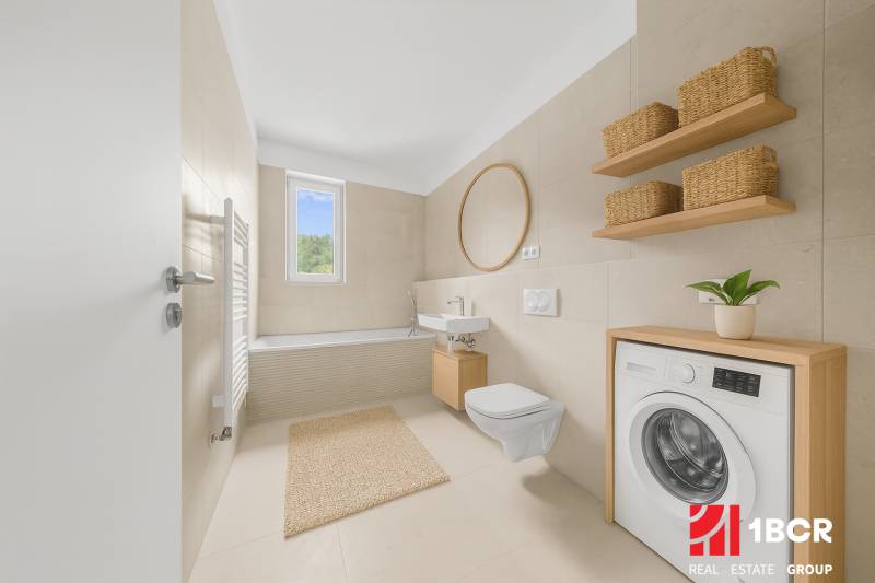 Bathroom with a bathtub, sink, mirror, and washing machine in a 2-room apartment.