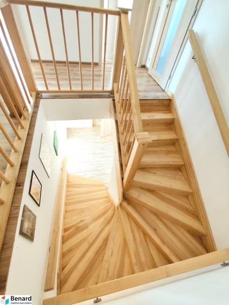 A staircase with a wooden decor and railing in a family house.