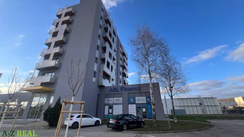 Office building on Račianska in Bratislava - Rača and parking lot in front of the building.
