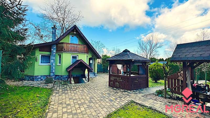 Garden cottage in Partizánske with a garden gazebo and a paved walkway.