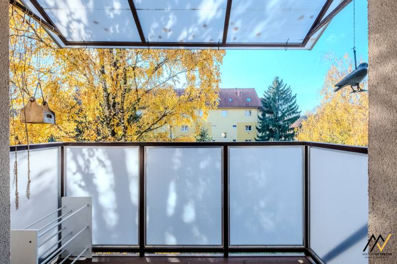 A balcony with a view of colorful trees and an apartment building, Prešov, Tarasa Shevchenka, 2-room apartment.