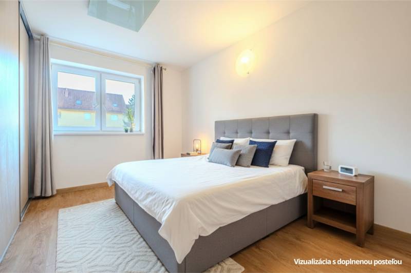 Bedroom in a 2-room apartment with a comfortable bed, a nightstand, and a floor with a wooden decor.