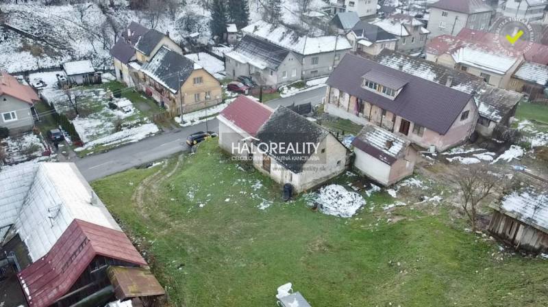 Family houses in Klenovec with a snow cover in the winter season.