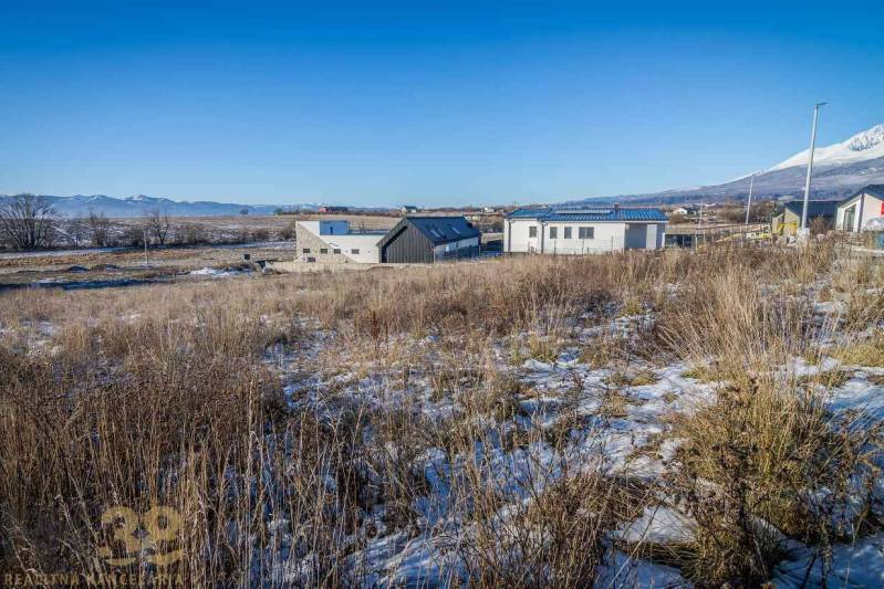 Residential plots in Mlynica with panoramic views and modern buildings in the background.