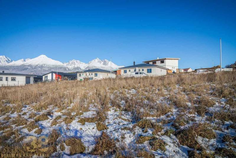 Residential plots in Mlynica with panoramic views and modern buildings in the background.