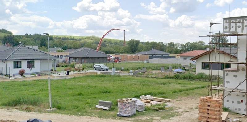 Plots - housing in Modrovka; visible unfinished houses and building materials.