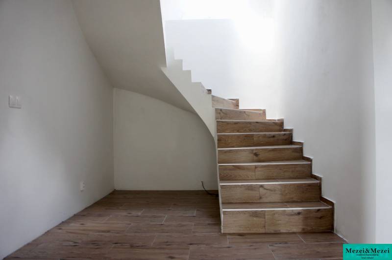 Staircase with wooden decor flooring in a family house.