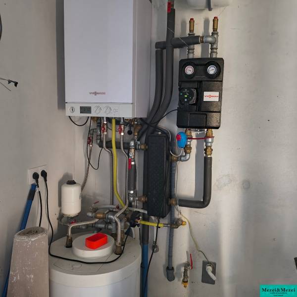 Heating with a mechanism in a family house with a modern boiler and piping.