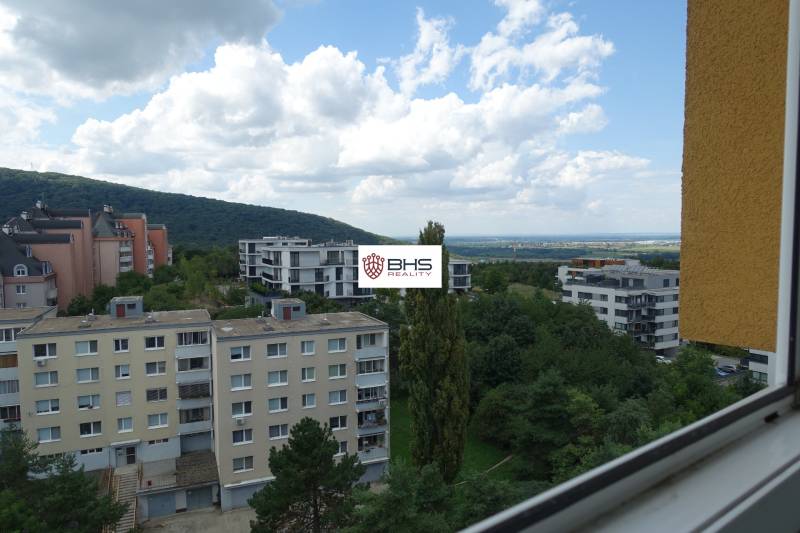 View from a 3-room apartment in Bratislava - Dúbravka, Homolova, with a panorama of the city and hills.