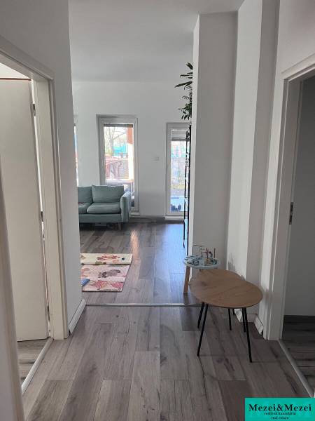 Leather sofa, bright room, floor with wood decor, 4-room apartment.