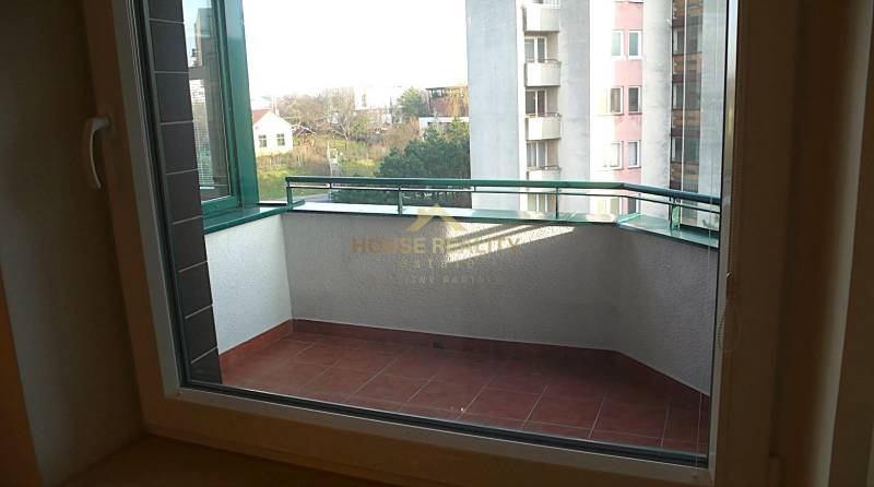 A balcony with a view of the surroundings and buildings, suitable for a 4-room apartment.