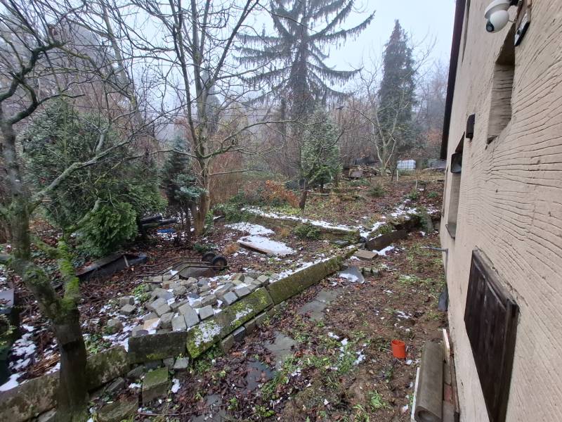 Garden at a family house on Búdková Street in Bratislava - Old Town, trees and stones.
