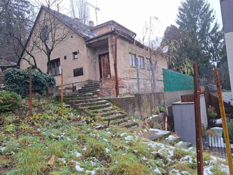 A family house on Búdková Street in Bratislava - Staré Mesto with a snow-covered garden.