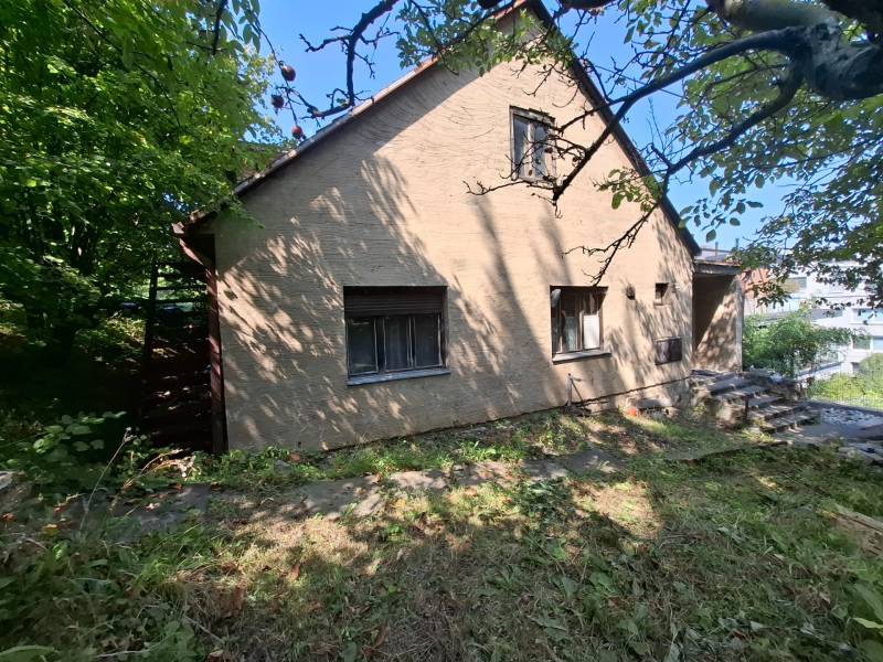 A family house on Búdková in Bratislava - Staré Mesto surrounded by greenery and a grassy plot.