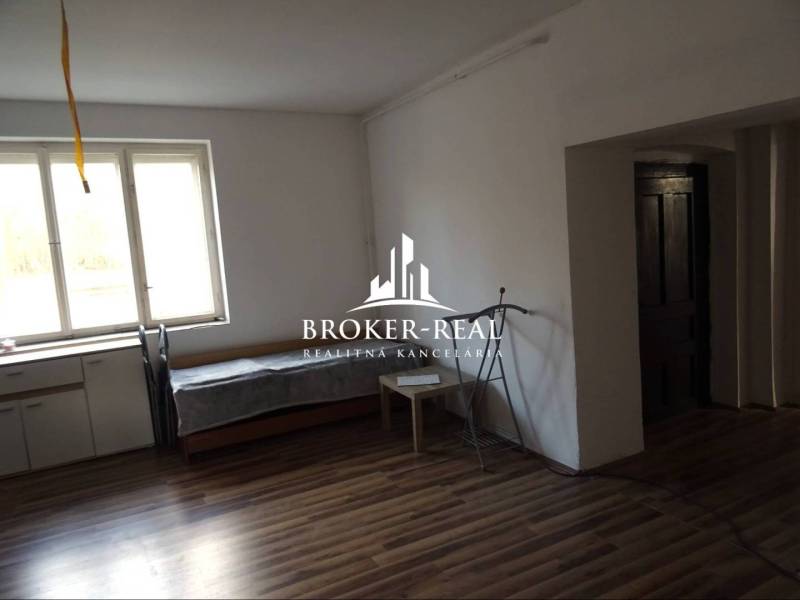 A family house with a wooden decor floor, window, and furniture.