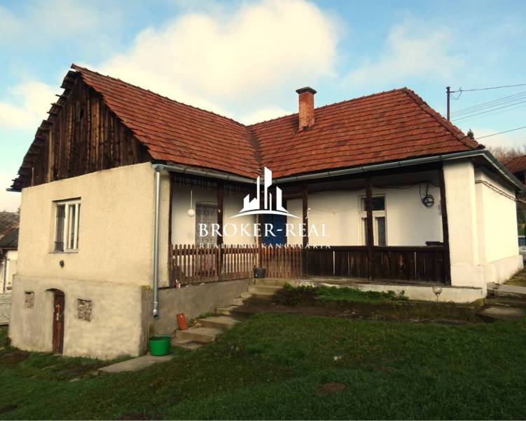 A family house in Rudabánya with a grassy garden and a gable roof.