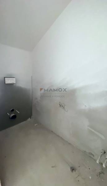 A partially furnished bathroom in a family house, ready for the installation of sanitary equipment.