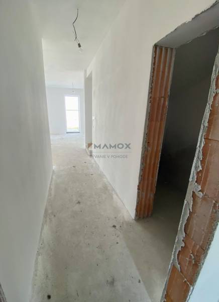 Hallway in a family house, plastered walls, basic electrical installation prepared.