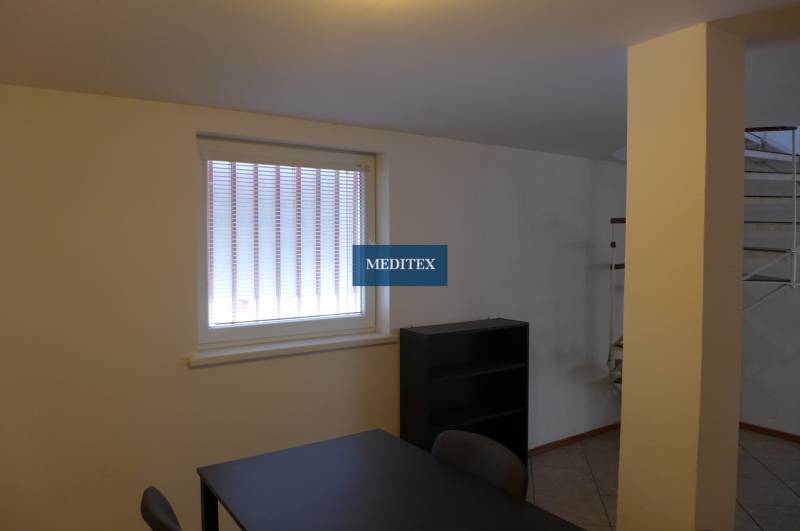 Office space with a desk and shelf, warehouses and halls, bright atmosphere.