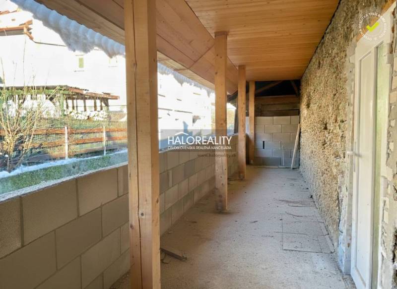 Built-up area of a family house in Hronec with stone walls and wooden beams.