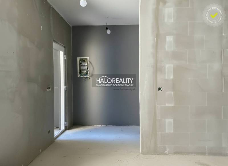 Interior of a family house with plastered walls and electrical wiring.