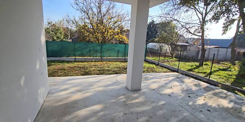 A family house in Piešťany with a garden, a fenced yard with a lawn and trees on the property.