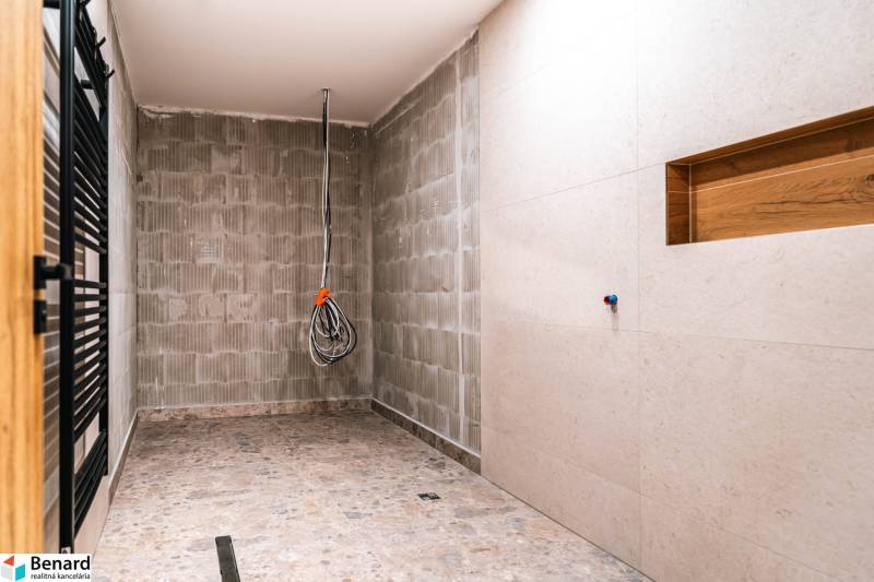A bathroom in a family house with a stone floor during renovation.