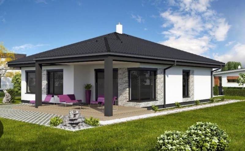 A family house in Most pri Bratislave with a terrace, lawn, and outdoor seating.