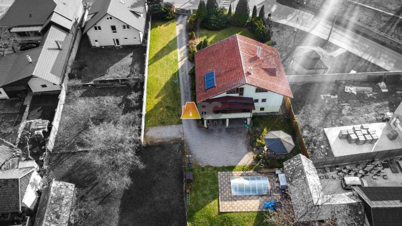 Aerial view of a villa on Andreja Sládkoviča Street in Žarnovica with a yard and a swimming pool.