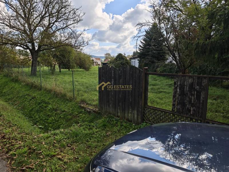 Plots - housing on Malá Domaša Street in Vranov nad Topľou, fenced green area with trees.