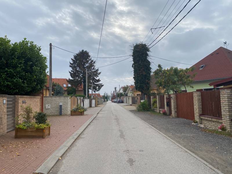 Pšeničná Street in Bratislava - Podunajské Biskupice with a row of family houses.