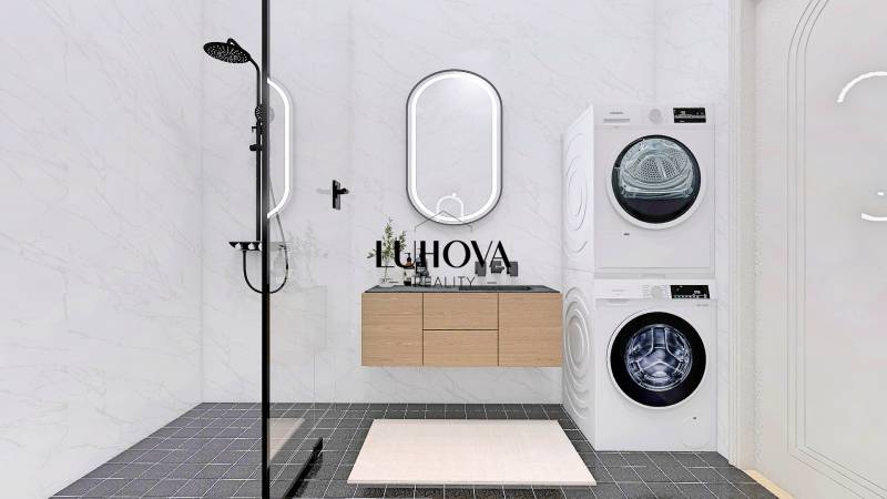 A bathroom in a family house with a washing machine, dryer, and shower.