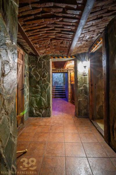 Stone walls and a brick ceiling create a rustic atmosphere in the building's interior.