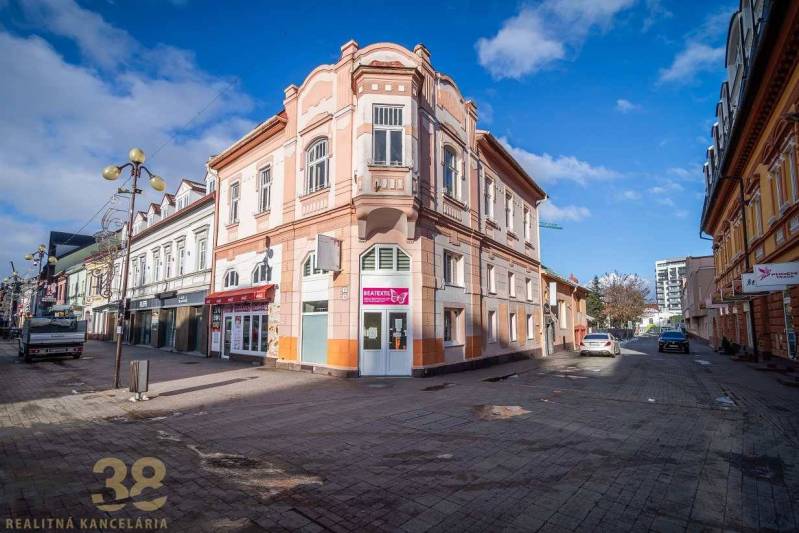 A historic building in Poprad with decorative architectural elements on the corner of the street.