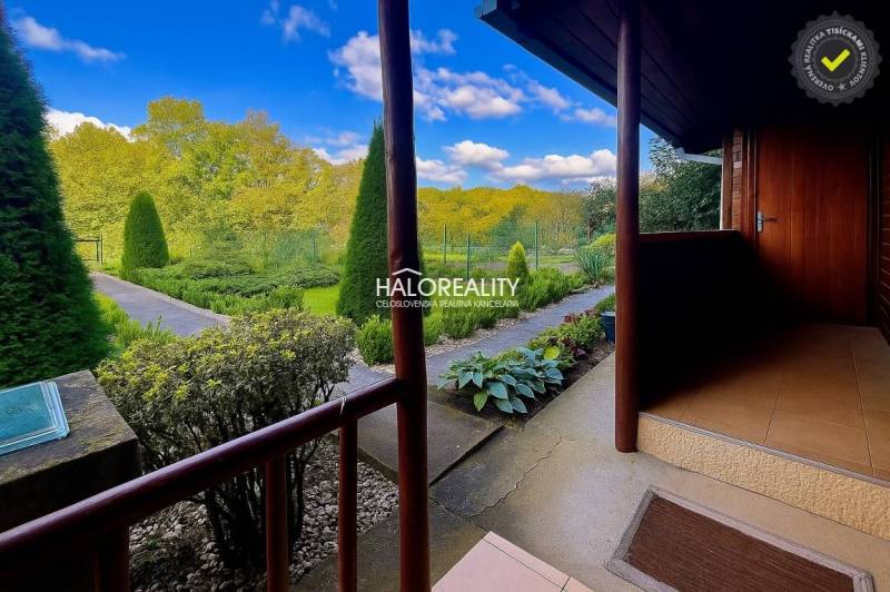 Gardens in Bytča with maintained paths, a hedge, and a view of greenery.