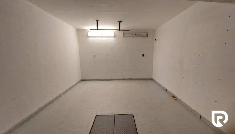 A spacious room with white walls and bright lighting in a 3-room apartment.