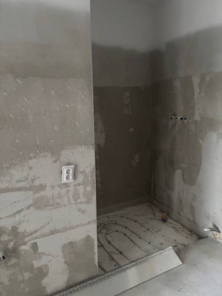 Renovations in the bathroom of a family house, water piping, and electrical outlets.