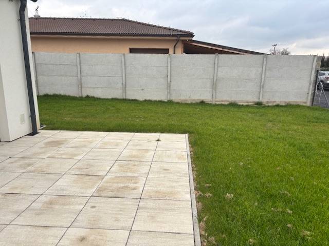 A family house in Tomášov on Fialková Street with a garden, terrace, and fence.