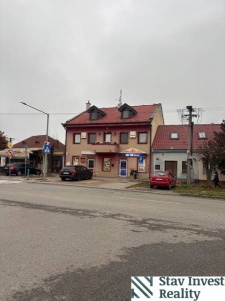 A building with a red roof and shops on Šafárikova Street, Senec, suitable for offices.
