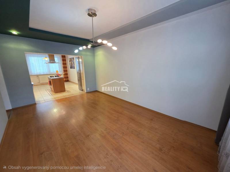 Dining room and kitchenette in a 4-room apartment with wood-patterned flooring.