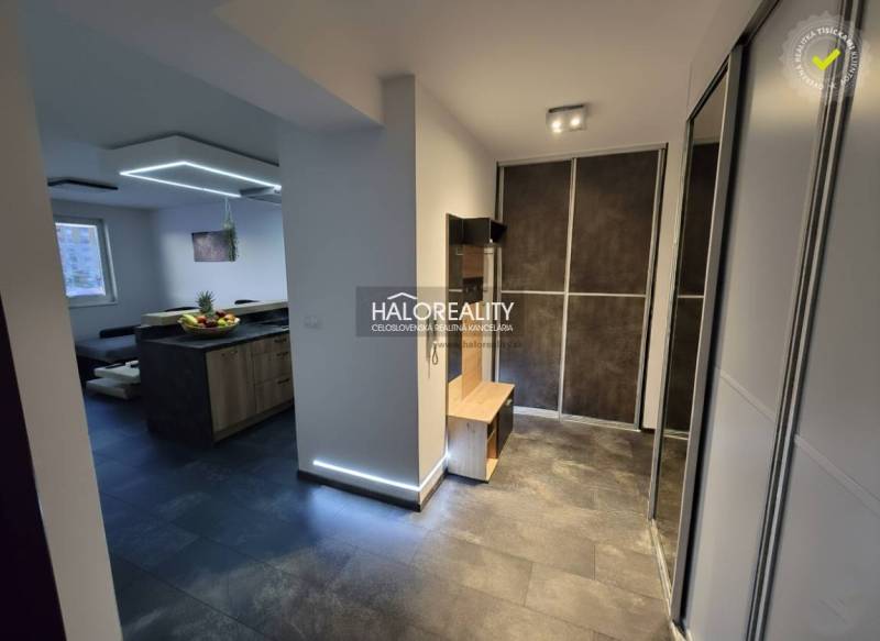 In the 2-room apartment, there are wardrobes, a dining table, and a kitchen unit.