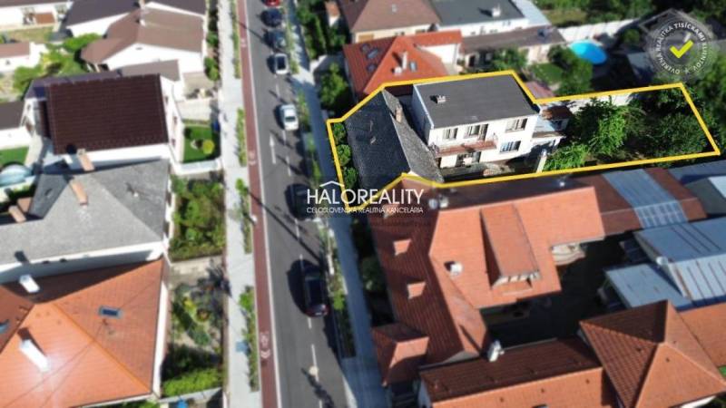 Aerial view of a family house in Malacky with surrounding gardens.