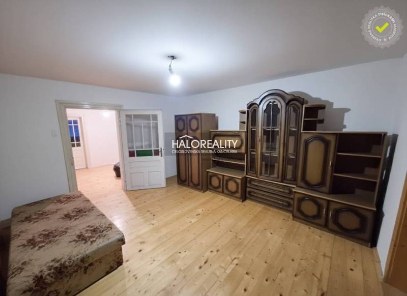 A room in a family house with furniture and a wooden decor floor.