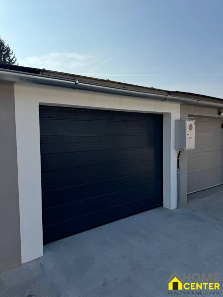 The gate of a modern garage on Slnečná Street in Komárno, equipped with electric control.