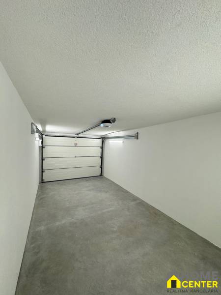 Garages with white walls and concrete floors on Slnečná Street in Komárno.
