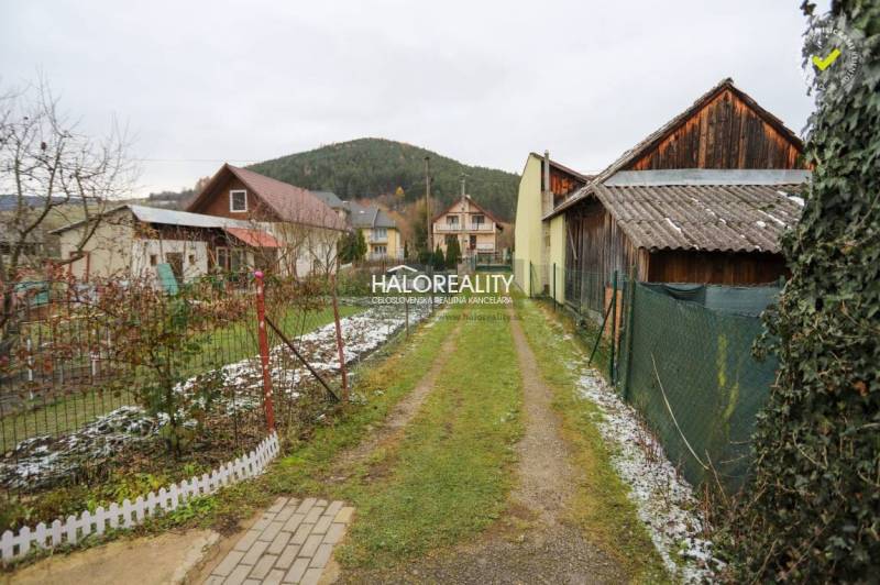 A path to a family house in Brvnište, snowy grass, rural environment.
