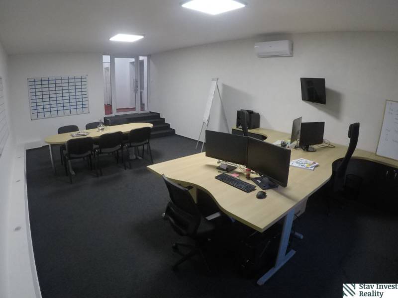 Offices with desks, computers, chairs, and air conditioning, without wooden floor decor.