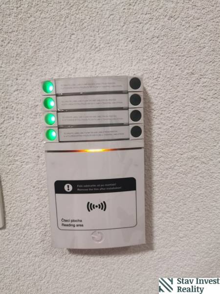 Card reader in offices, with colored LED indicators, mounted on the wall.